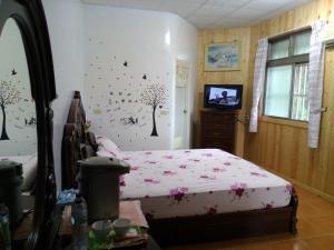 Postel nebo postele na pokoji v ubytování Kai Tai B&B