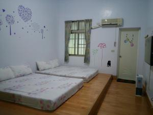 Postel nebo postele na pokoji v ubytování Kai Tai B&B