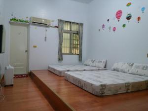 Postel nebo postele na pokoji v ubytování Kai Tai B&B