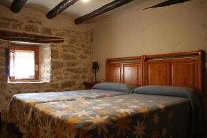 Ένα ή περισσότερα κρεβάτια σε δωμάτιο στο Casa Leandron