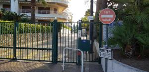 a gate with a do not enter sign next to a building at Palm beach Cannes Azur in Cannes