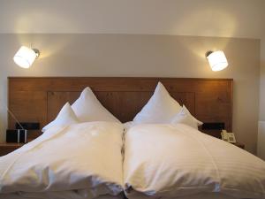 Postel nebo postele na pokoji v ubytování Hotel Germania