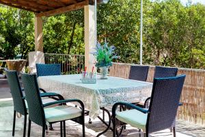 a table and chairs on a patio at Holiday Home Dada in Vela Luka
