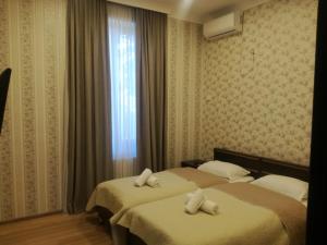 Postelja oz. postelje v sobi nastanitve Guest House Kakheti