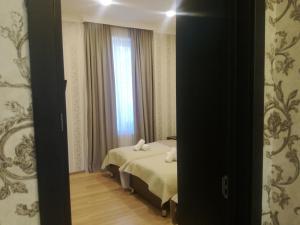 Postelja oz. postelje v sobi nastanitve Guest House Kakheti