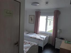 Postel nebo postele na pokoji v ubytování Råda Hotel