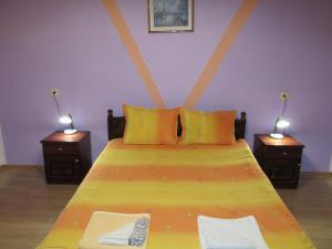 A bed or beds in a room at Pri Orehite Guesthouse