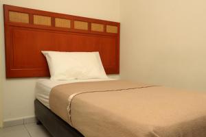 Postel nebo postele na pokoji v ubytování Hotel Rembia