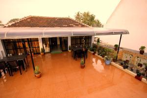 an overhead view of a patio with tables and chairs at Sea View Apartments in Cochin