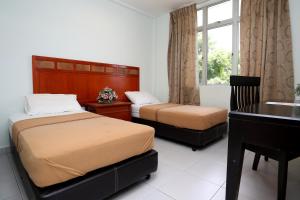 Postel nebo postele na pokoji v ubytování Hotel Rembia