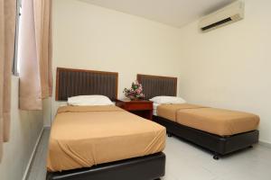 Postel nebo postele na pokoji v ubytování Hotel Rembia