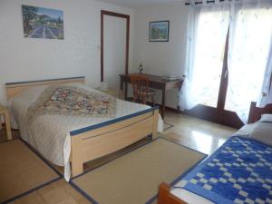 Кровать или кровати в номере Clos de la Natouze