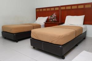 Postel nebo postele na pokoji v ubytování Hotel Rembia