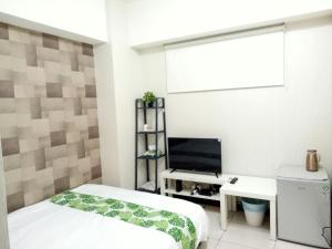 Llit o llits en una habitació de 梧桐樹