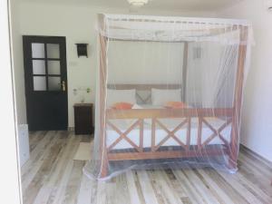 a bed with a canopy in a room at Villa Kandy with Private Pool in Kandy +27 photos