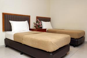 Postel nebo postele na pokoji v ubytování Hotel Rembia