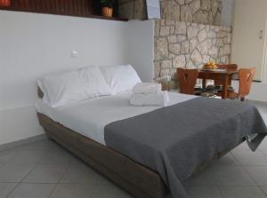 Postel nebo postele na pokoji v ubytování Apartmani Deniz