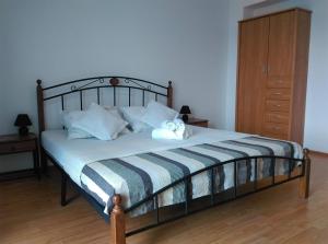 Postel nebo postele na pokoji v ubytování Apartmani Deniz