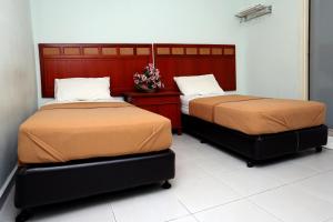 Postel nebo postele na pokoji v ubytování Hotel Rembia