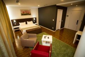 Rúm í herbergi á Havana Hotel