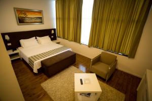 Rúm í herbergi á Havana Hotel