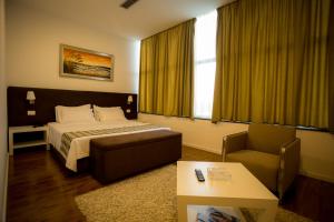 Rúm í herbergi á Havana Hotel