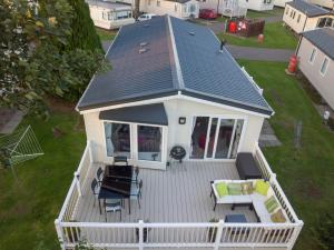 an overhead view of a white house with a deck at Haggerston Lola the Lodge and Betty the Van in Cheswick