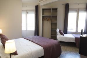 Cama o camas de una habitación en Fonda Montserrat