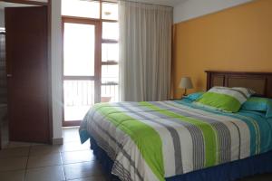 Postel nebo postele na pokoji v ubytování Hotel Bracamonte