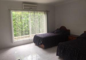Cama o camas de una habitación en Casa Quinta PeÃ±on para grugos Girardot