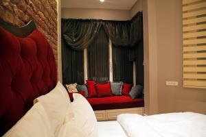 A bed or beds in a room at Frida Suites