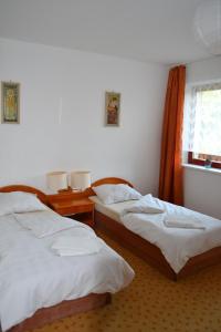 a room with two beds and a window at Levandule in Brno