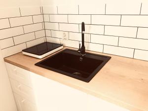 Kuchyňa alebo kuchynka v ubytovaní Apartament Bulwary Warty + 5 fotografií