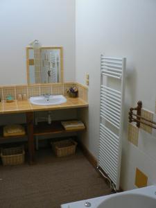 a bathroom with a sink and a mirror at Chambres d'hôtes Domaine de Beaupré in Narbonne +14 photos