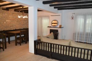 a living room with a couch and a dining room at Casa Bella in Dunavtsi +66 photos