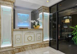 a dressing room with a vase of flowers on a counter at FENIX TOWN in Vinnytsya