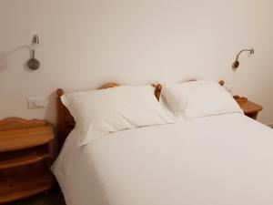 Postel nebo postele na pokoji v ubytování Nido di Rondine B&B