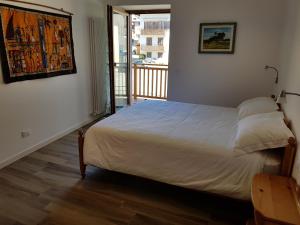 Postel nebo postele na pokoji v ubytování Nido di Rondine B&B