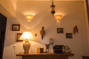 a room with a table with lights on the wall at Wine Aparts in Mendoza