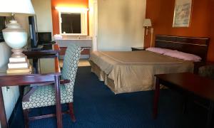 Postel nebo postele na pokoji v ubytování Executive Inn Texarkana