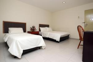 Postel nebo postele na pokoji v ubytování Hotel Rembia