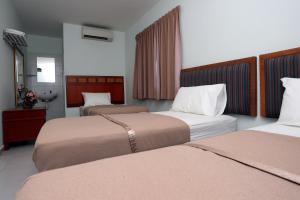 Postel nebo postele na pokoji v ubytování Hotel Rembia