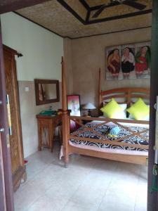 En eller flere senger på et rom på Umah Ubud B&B