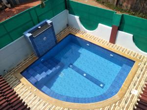 an overhead view of an empty swimming pool at GR Stays - 3Bhk Private Villa in Calangute with Private Jacuzzi Pool in Calangute