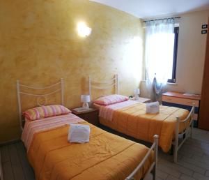 Postel nebo postele na pokoji v ubytování La Bella Addormentata