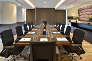 a large conference room with a long table and chairs at Swiss-Belresidences Juffair in Manama +47 photos