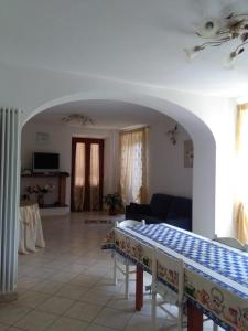 a living room with a table and a couch at Monti Mare in Seravezza