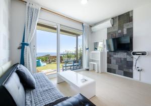 TV a/nebo společenská místnost v ubytování Jeju Turning point Pension
