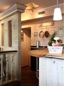 a kitchen with a wooden counter top in a room at Stadt-gut-Hotel Rheinischer Hof in Essen