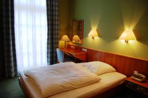 Кровать или кровати в номере Hotel Frankenbach